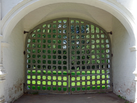 Wooden gate in the brick wallの写真素材