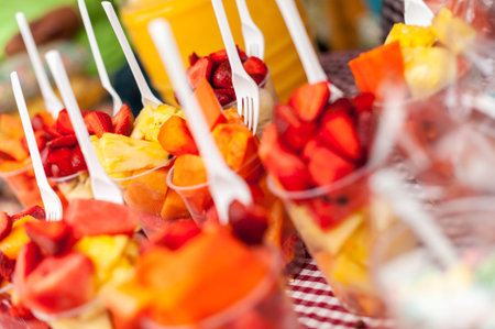 pieces of different fruits served in glass, fruit color