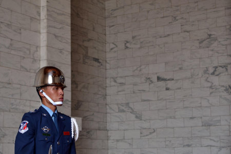 A Taiwanese guard was standing still while protecting the area of CKS Memorial Hall, in Taipei.