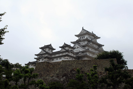 Walking closer to Himeji Castle (that's also called "White Heron") located on a hilltop on a cloudy day. Pic was taken in August 2017.のeditorial素材