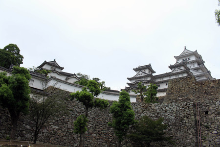 Walking closer to Himeji Castle (that's also called "White Heron") located on a hilltop on a cloudy day. Pic was taken in August 2017.のeditorial素材