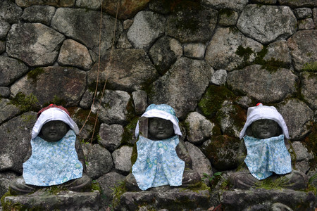 The statues of Baby Buddha wearing hat and cute clothes? Pic was taken in Japan, August 2017.のeditorial素材
