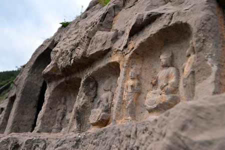 The holes (with Buddha statue inside) -which is more than thousands- around Longmen Grottoes on the hill. Pic was taken in September 2017の写真素材
