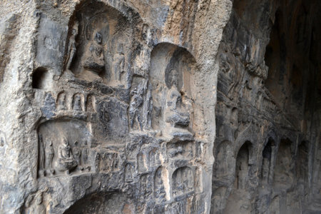The holes (with Buddha statue inside) -which is more than thousands- around Longmen Grottoes on the hill. Pic was taken in September 2017のeditorial素材