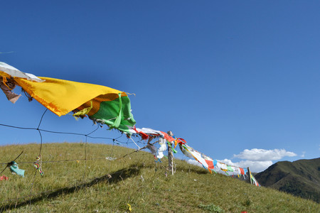 The prayer flags around the mountain behind Labrang or Xiahe, in Amdo Tibet. Pic was taken in September 2017.の写真素材