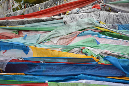 The prayer flags around the mountain behind Serti Gompa Monastery, in Langmusi - Amdo Tibet. Right next to it is the place to conduct sky burial ceremony. Pic was taken in September 2017.の写真素材