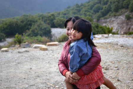 A mom and her cute daughter. The lady lives around Mount Papandayan, and sold some food to hikers for living. Pic was taken in Garut, August 2014.のeditorial素材