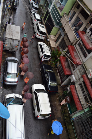 Quiet morning in Yangon, Burma. Some people already started their day, including monks asking for alms. Pic was taken in August 2015.のeditorial素材