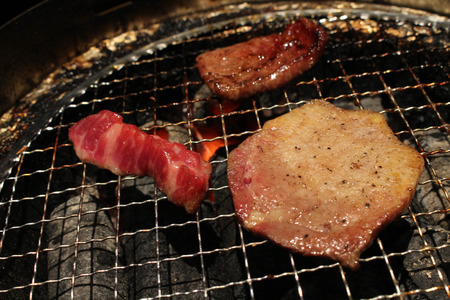 The food served at yakiniku (meaning "grilled meat" or "barbecue") restaurant in Japan. Beef everywhere. Taken in Tokyo, March 2018.のeditorial素材