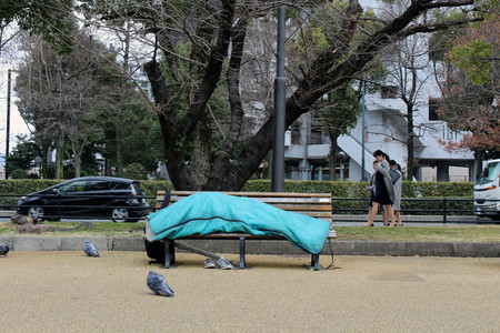 Homeless in the city center of Hiroshima, Japan. Sleeping in the park. Taken in Hiroshima, March 2018.のeditorial素材