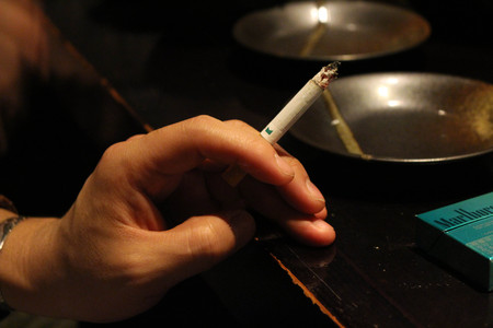 The situation inside Izakaya restaurant, an informal Japanese pub. The menu are raw horse meat (!) and edamame. Taken in Tokyo, March 2018.のeditorial素材