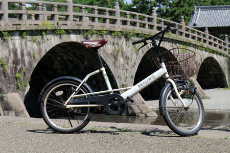 Closeup view of bicycle and ancient bridge at Ishibashi Memorial Park in Kagoshima. Taken in August 2019.の写真素材