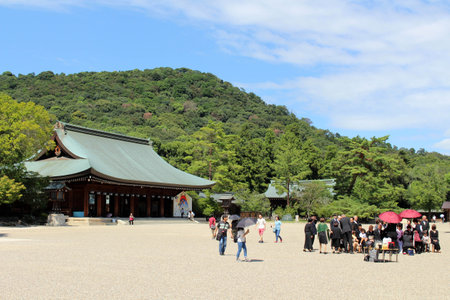 Japanese family taking photos in front of Kashihara Jingu Temple in Nara, Japan. Taken in September 2019.のeditorial素材