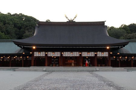 Miko or priestess of Kashihara Jingu Temple lighted by lanterns in Nara, Japan. Taken in September 2019.のeditorial素材