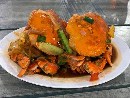 Indonesian sweet sour crab served on a plate.の写真素材