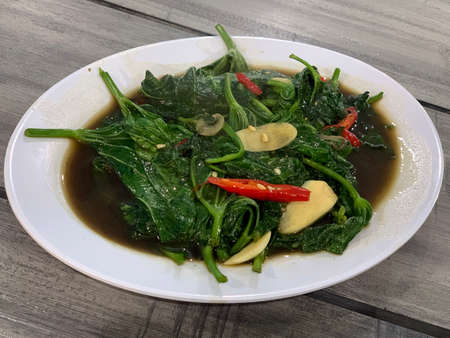 Closeup of cah kangkung, kangkong, or water spinach stirred.の写真素材