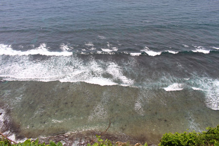 Crashing waves around Uluwatu Temple in Bali. Taken January 2022.の写真素材