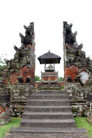 Entrance of Taman Ayun made of bricks and wooden door. Taken January 2022.のeditorial素材