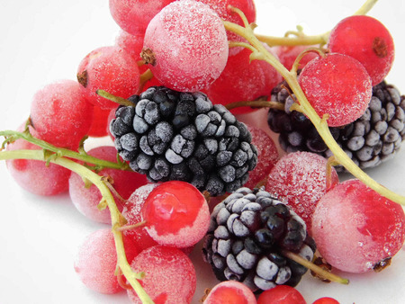 Frozen red currant and mulberry macro photo.の写真素材