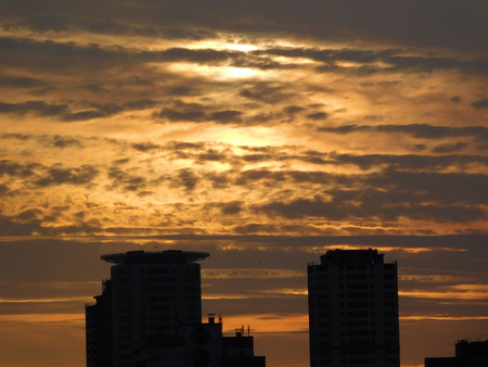 Beautiful clouds at sunset over the buildings.の写真素材