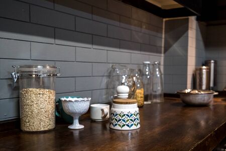 White brick kitchen detail with cooking accessoriesの写真素材