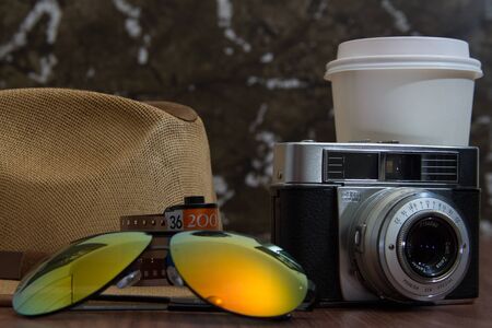 variety of essential items for hipsters. Lenses, camera, hat and coffeeの写真素材
