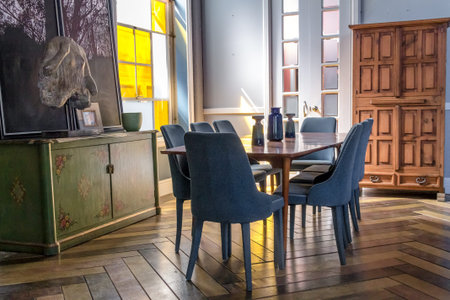 Dining room with blue chairs and wooden floor