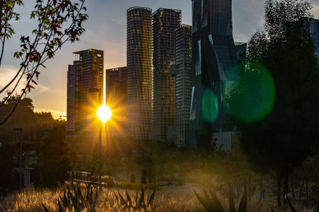Sunset in Santa Fe Mexico. Sun hiding behind the buildings. against light