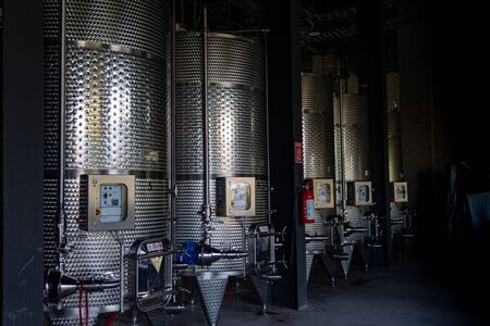fermentation tanks for making different types of whiskey in the Distilleryの写真素材
