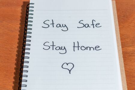 Stay safe sign, work from home. with various office objects The office is closed. Pandemic Covid-19 Coronavirus quarantine conceptの写真素材