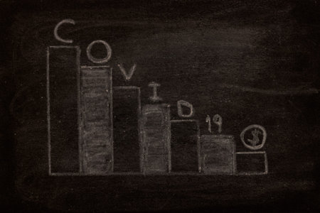 Statistical bars, drawn with chalk on black board, concept of economy and coronavirus