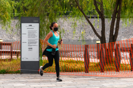 La Mexicana, Santa Fe, Mexico City: June 9, 2020. Athletic woman running during the quarantine for...