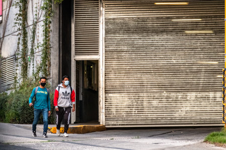 Santa Fe, Mexico City: June 9, 2020. People on the street wearing surgical masks, due to the covid...