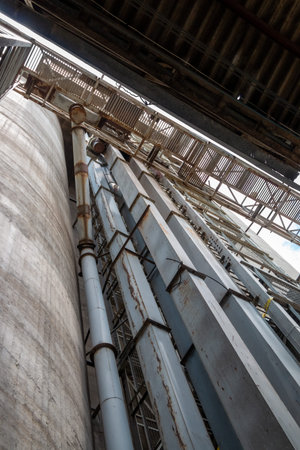 The cement silo represents data silos in computer science, which isolates data, since the only...
