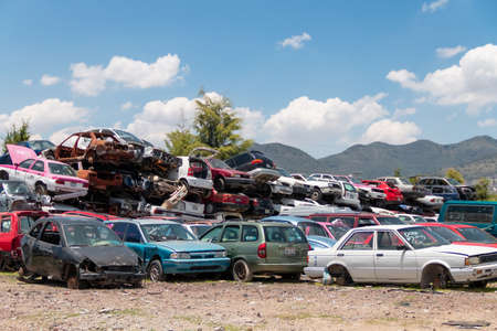 Old damaged cars on the junkyard waiting for recycling in Mexico City. Mexicoのeditorial素材