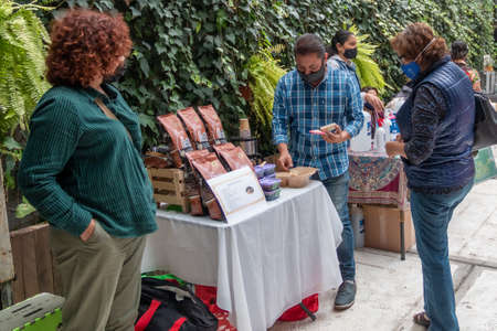 MEXICO CITY, MEXICO 08 08 2020 Woman buying organic products in local market. Fair tradeのeditorial素材