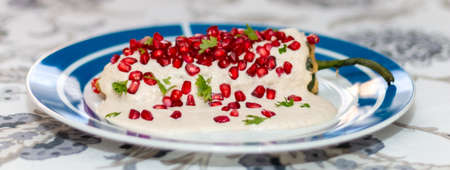 Chile en nogada, traditional festive dish on Mexican Independence Day. Green chili peppers with walnut sauce. National holidaysの写真素材