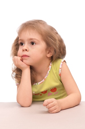 Thoughtful little girl. Portrait of a 3 year old girl.の写真素材