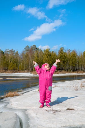 The girl of three years rejoices to approach of springの写真素材