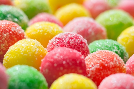The background of multicolored dragee close-upの写真素材