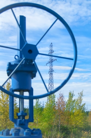 Oil valve with power masts in the backgroundの写真素材