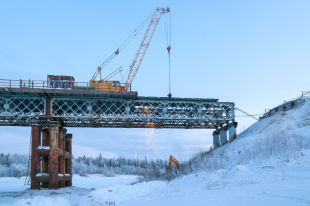 The cost of removing the old bridge on a winter eveningの写真素材