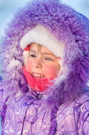 Portrait of a naughty girl with frozen eyelashes closeupの写真素材