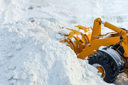 Clearing the road from snowの写真素材
