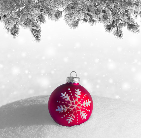Christmas red ball on snowdriftの写真素材