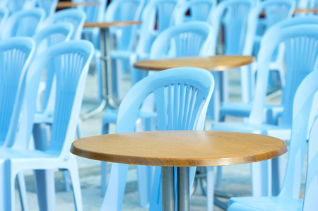 Round table and chairs in outdoor cafeの写真素材