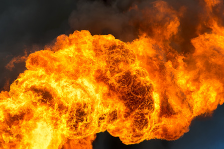 Huge flame against the black skyの写真素材