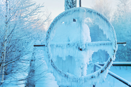 Gas pipelines with latch covered with snow and hoarfrostの写真素材