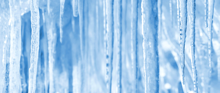 Natural winter bright background of shiny iciclesの写真素材