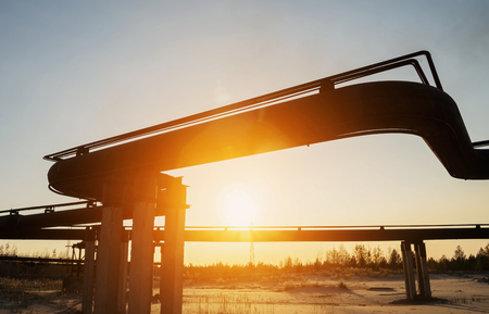 Gas pipeline in the background of the setting sunの写真素材